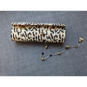 Animal print cylindrical clutch